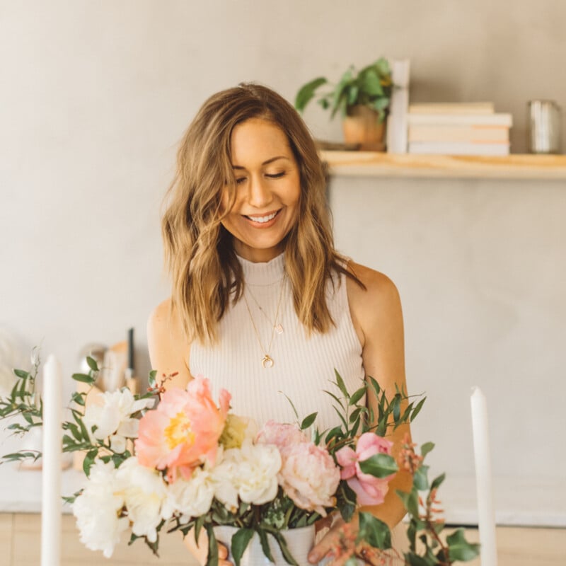 Camille Styles arranging flowers