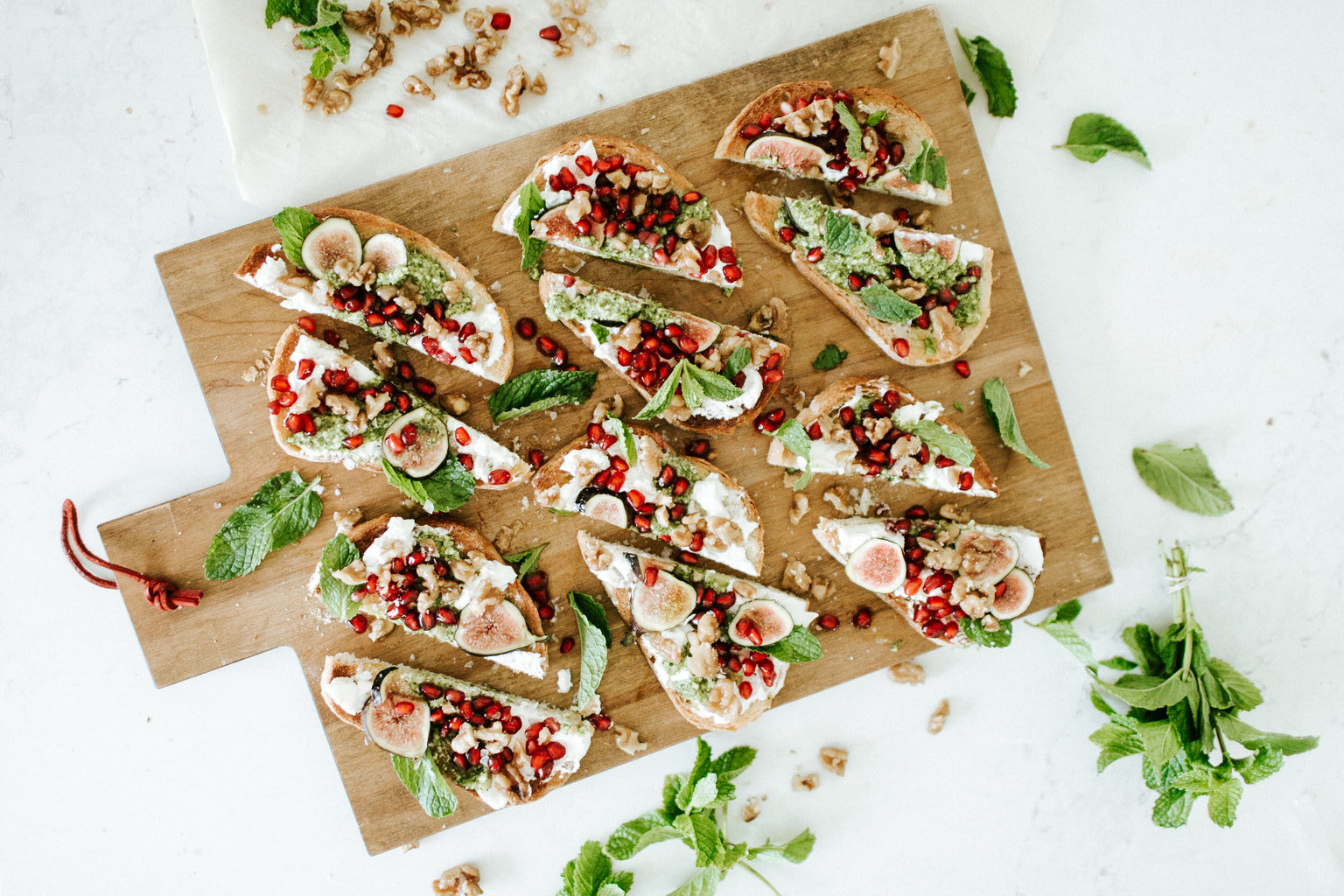 Burrata Toasts With Caramelized Walnuts and Mint-Pomegranate Pesto