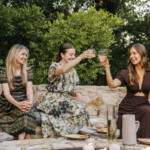 ladies doing cheers outside around fire pit_wellness practices