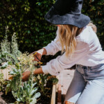 Woman gardening outside.