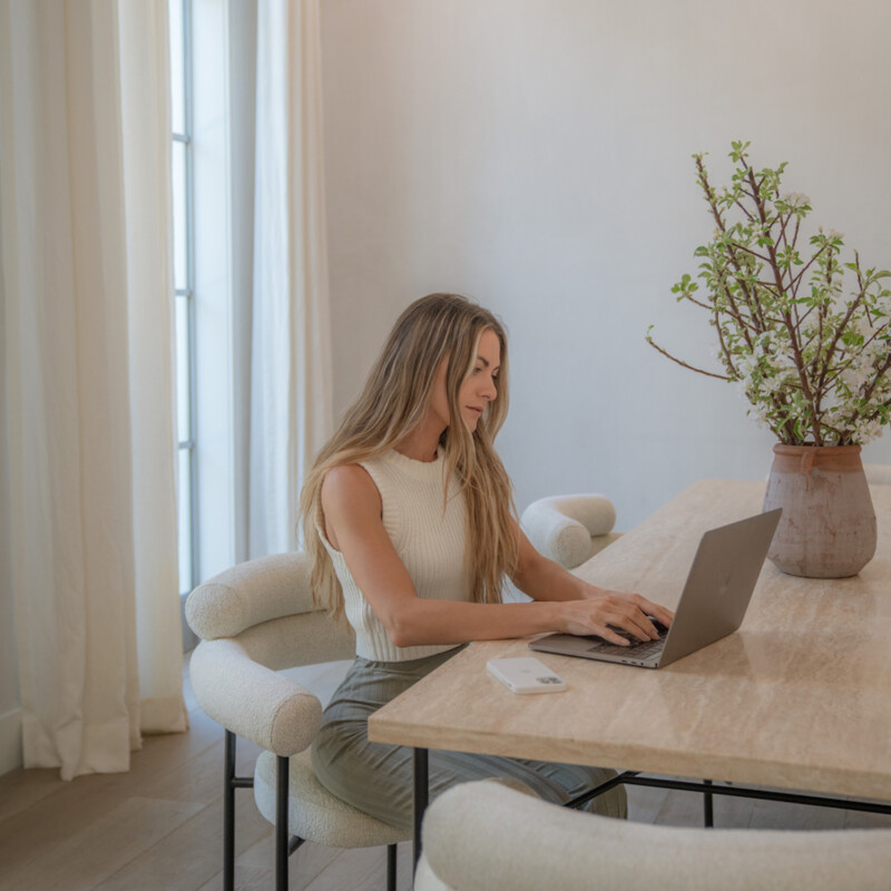 Woman typing on computer.